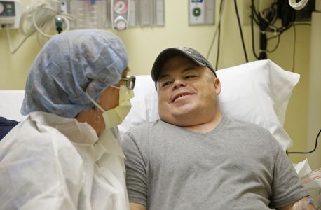 CORRECTS NAME OF DISEASE TO HUNTER SYNDROME FROM NPS - In this Monday, Nov. 6, 2017 photo, Brian Madeux sits with his girlfriend Marcie Humphrey while waiting to receive the first human gene editing therapy at the UCSF Benioff Children's Hospital in Oakland, Calif. Madeux, who has Hunter syndrome, received the treatment on Monday, Nov. 13. (AP Photo/Eric Risberg)